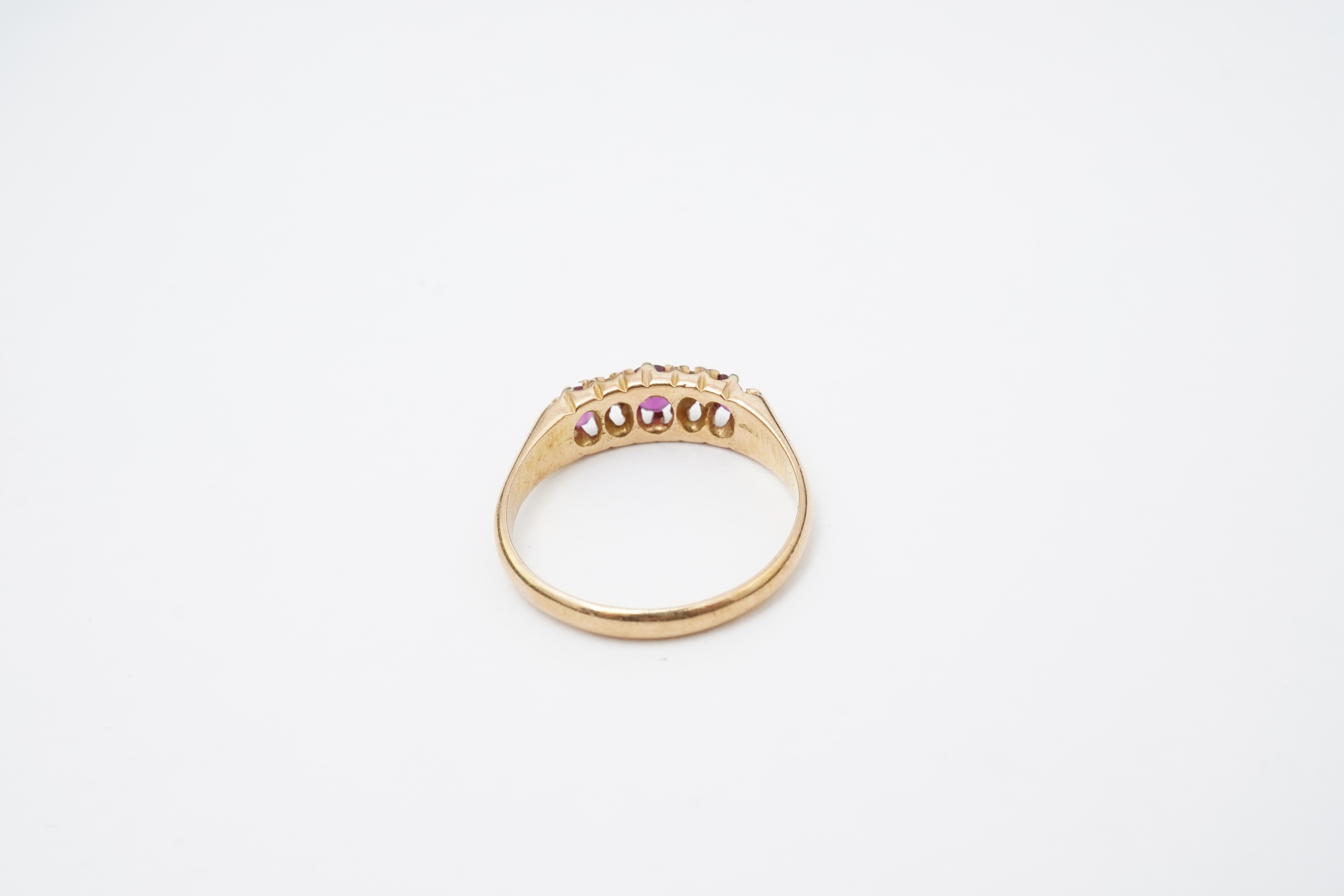 A ruby and diamond five-stone ring, circa 1900